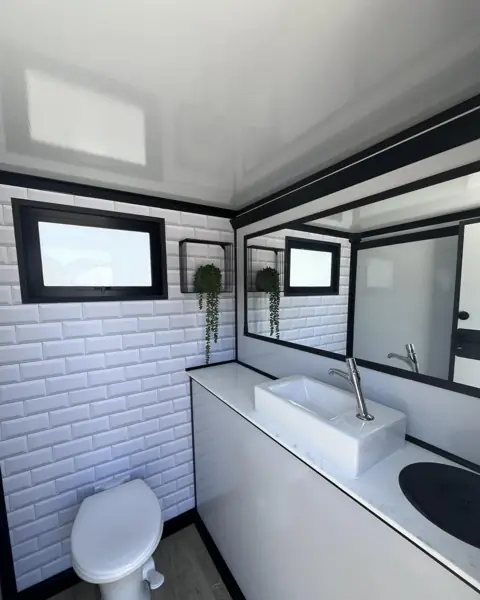 Tiled restroom trailer stall