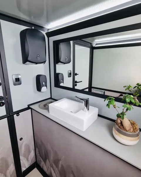 Restroom trailer vanity with mirror