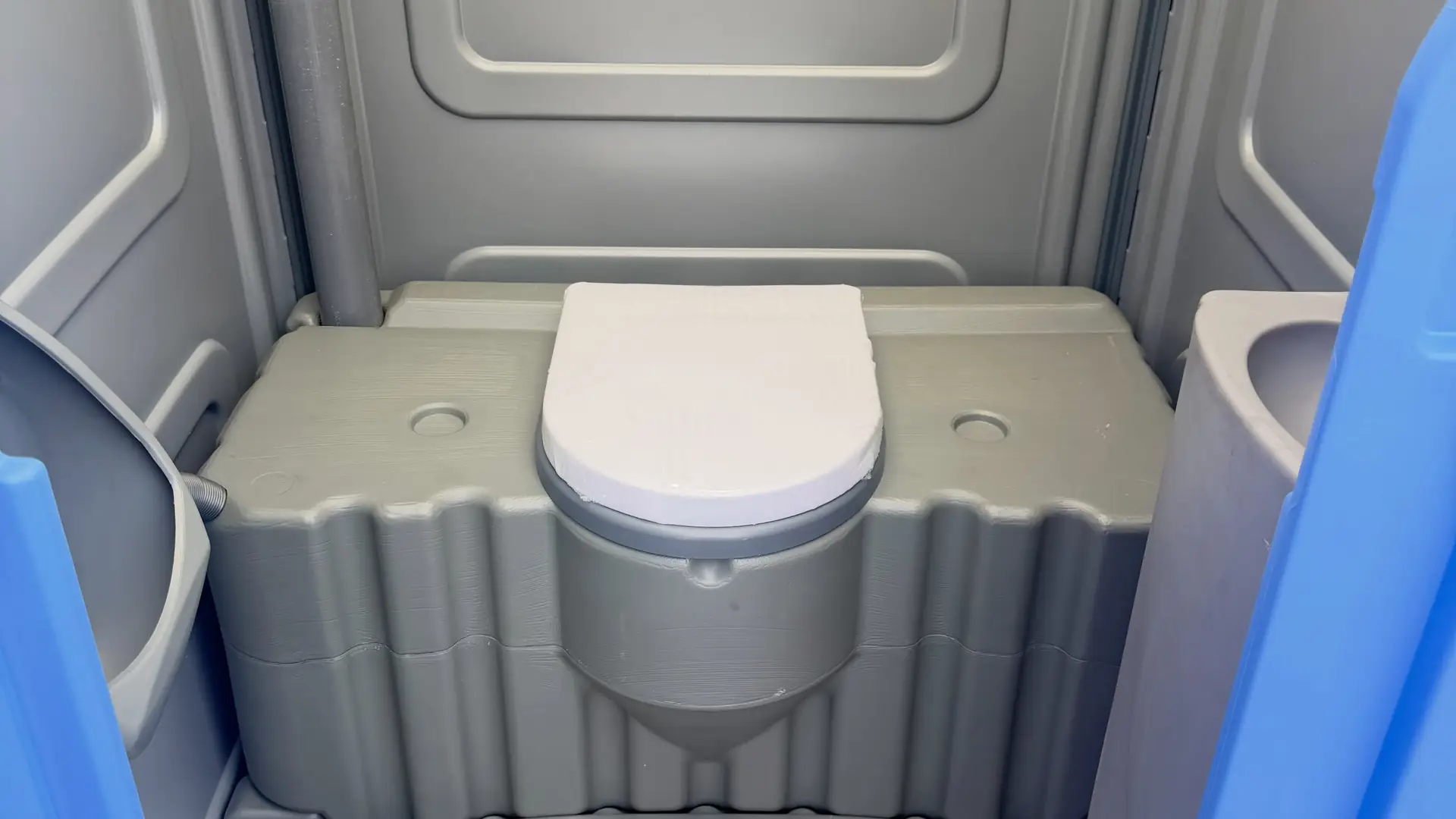 Open floor inside a wheelchair-accessible portable toilet