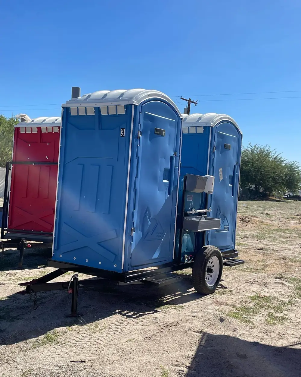 Toilets mounted on a small towable trailer