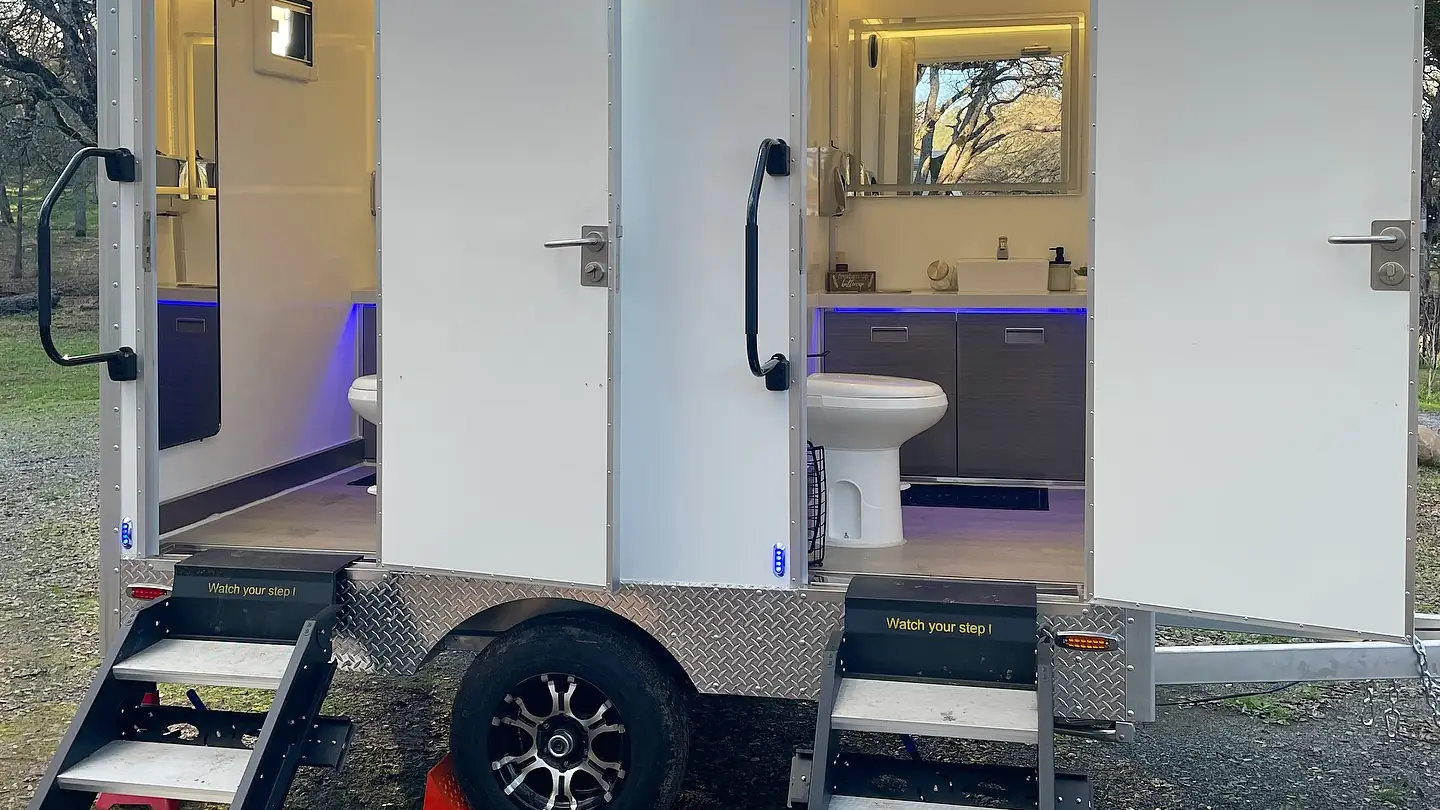 Two-stall restroom trailer with lit entry steps