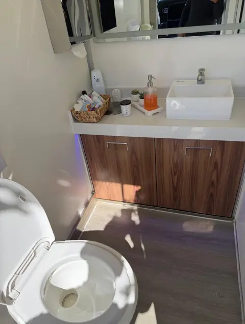 Vanity and vessel sink inside a VIP trailer